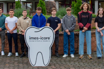 All new apprentices standing in front of the imes-icore headquarters in Eiterfeld